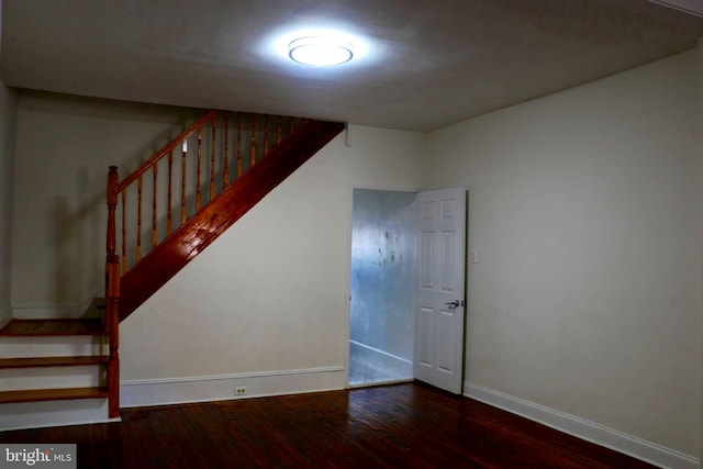 stairway featuring hardwood / wood-style floors