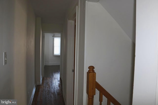 hallway with dark wood-type flooring