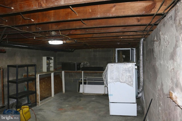 basement featuring white refrigerator