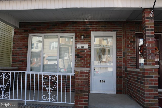 property entrance with covered porch