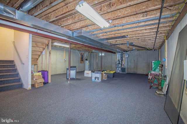 417 E Red Lion Dr, Bear, DE 19701 - unfinished basement featuring stairs, water heater, and carpet