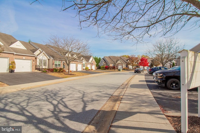 417 E Red Lion Dr, Bear, DE 19701 - view of asphalt street featuring a residential view, curbs, and sidewalks