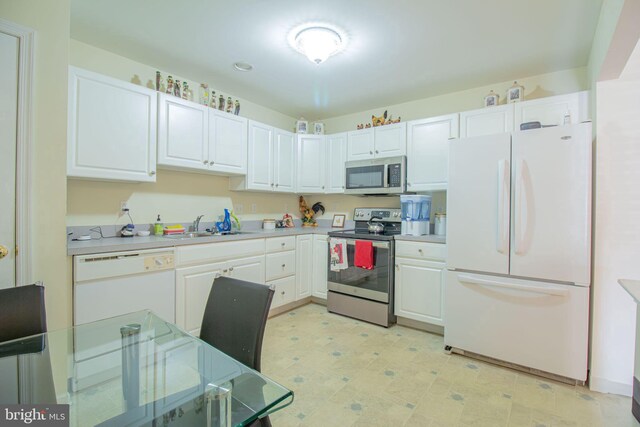 417 E Red Lion Dr, Bear, DE 19701 - kitchen with appliances with stainless steel finishes, a sink, white cabinetry, and light countertops