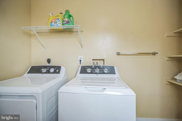 washroom featuring washer and dryer