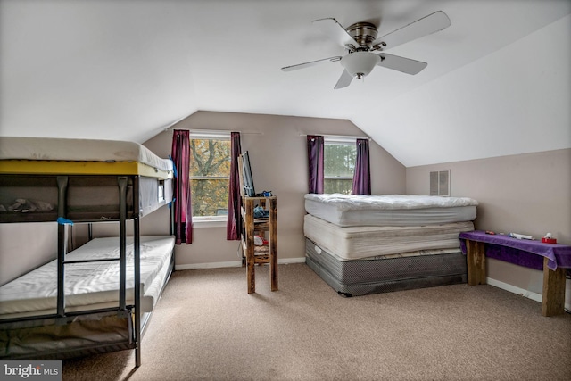 bedroom featuring carpet, lofted ceiling, and ceiling fan