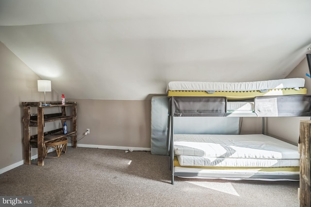 carpeted bedroom featuring vaulted ceiling