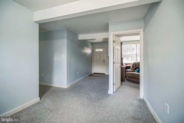 hallway featuring light carpet