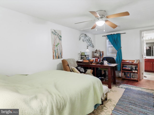 bedroom with ceiling fan, wood-type flooring, and ensuite bathroom