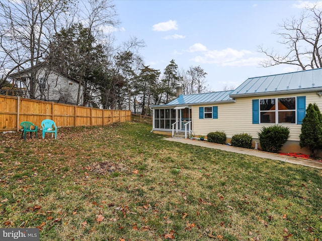 view of yard featuring a sunroom