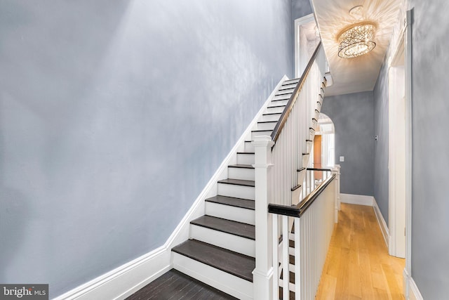 stairs featuring hardwood / wood-style flooring