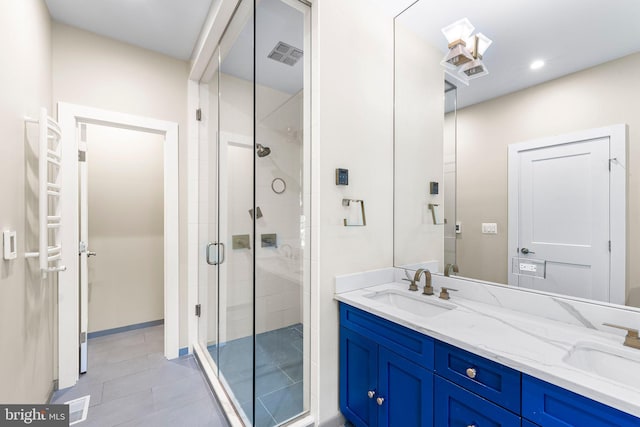 bathroom with an enclosed shower and vanity