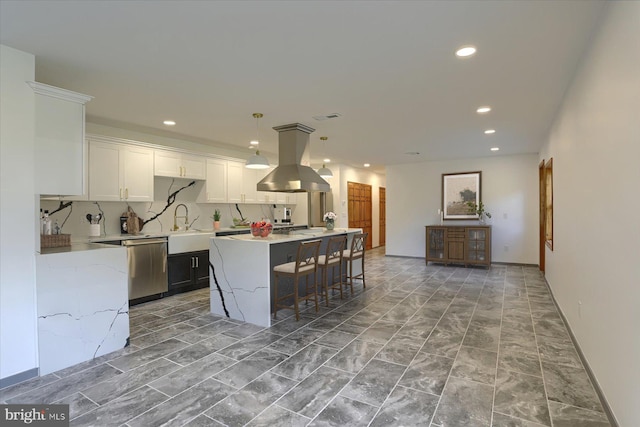 kitchen with a center island, hanging light fixtures, tasteful backsplash, island range hood, and white cabinets