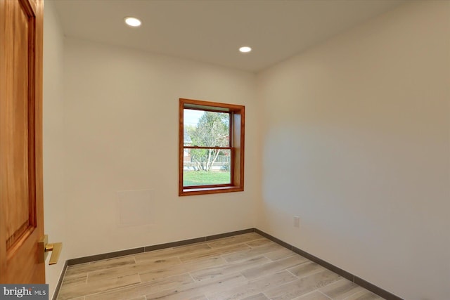 unfurnished room with light wood-type flooring