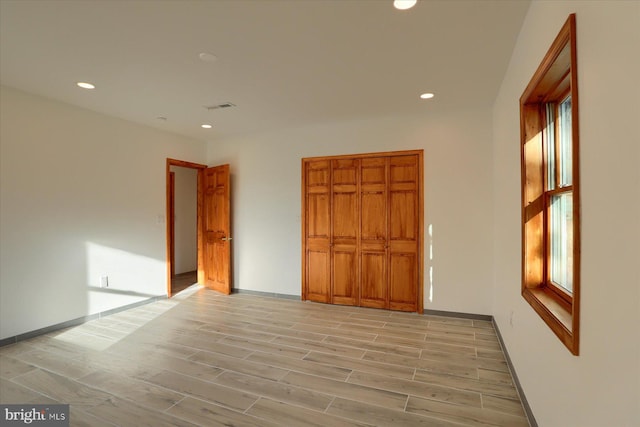 unfurnished room with light hardwood / wood-style flooring