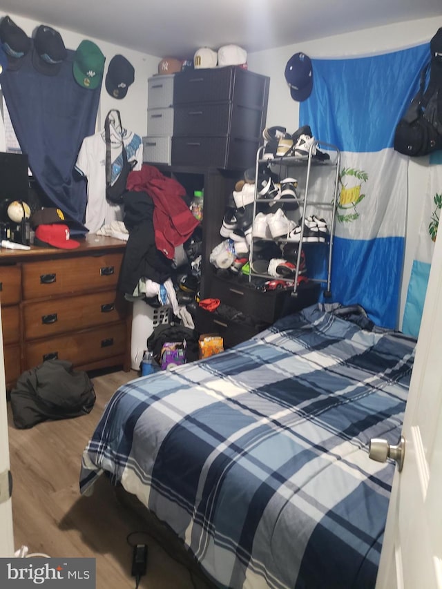 bedroom featuring hardwood / wood-style flooring