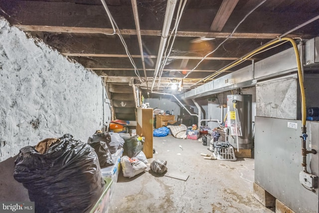 basement featuring heating unit and gas water heater