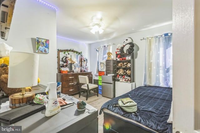 bedroom featuring light hardwood / wood-style flooring and ceiling fan