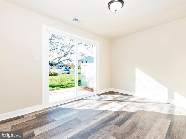 empty room with wood-type flooring