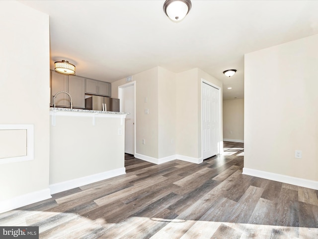 spare room with dark wood-type flooring