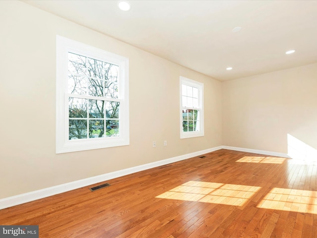 unfurnished room featuring light hardwood / wood-style floors