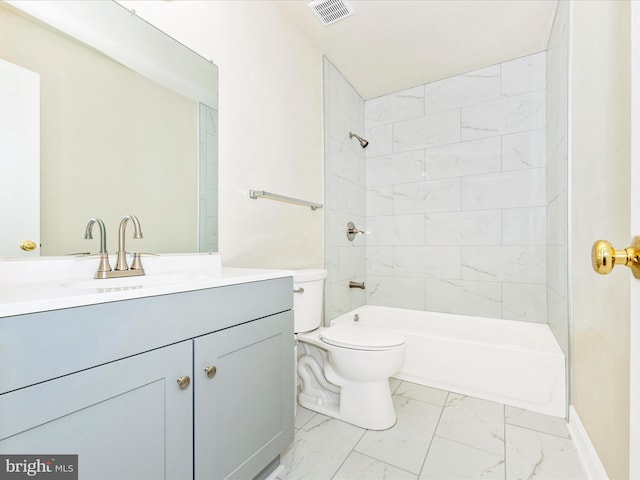 full bathroom with vanity, tiled shower / bath combo, and toilet