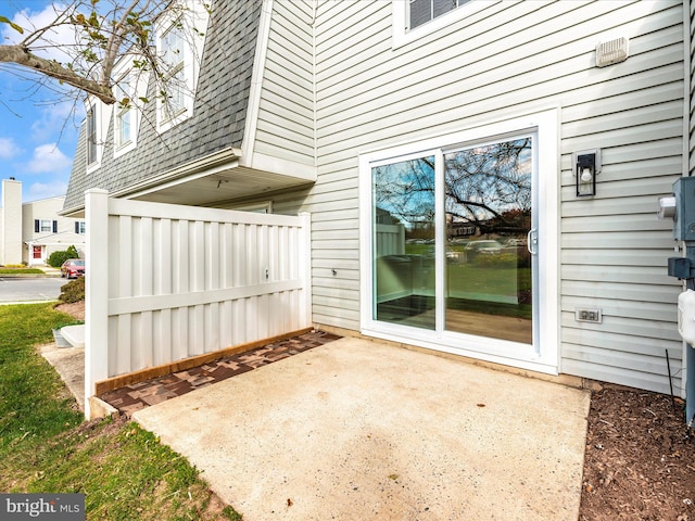 entrance to property with a patio area