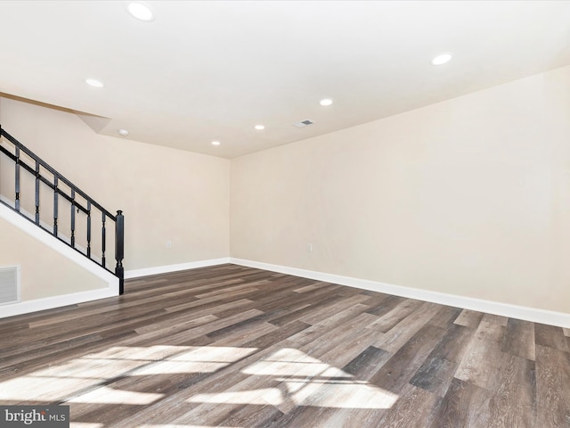 spare room with dark hardwood / wood-style floors