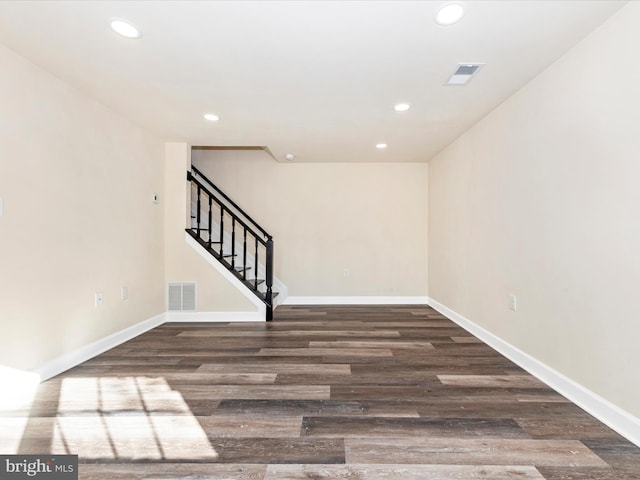 spare room with dark hardwood / wood-style floors