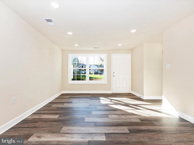 spare room with dark hardwood / wood-style floors