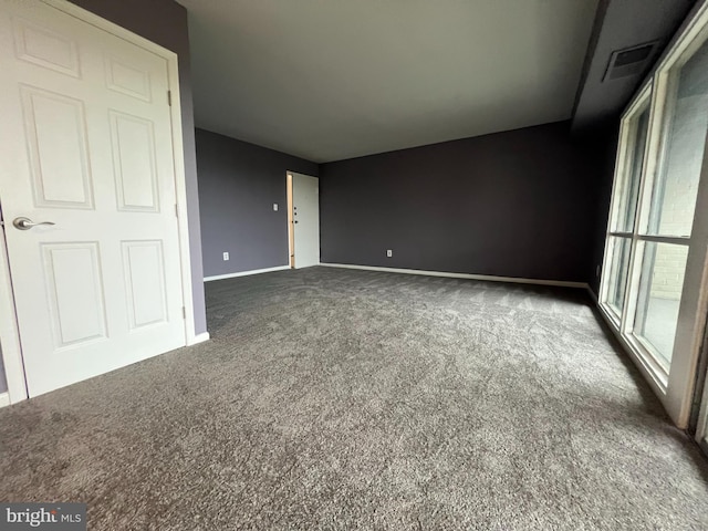 interior space with dark carpet