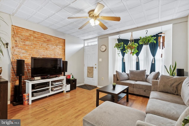 living room featuring light hardwood / wood-style floors and ceiling fan