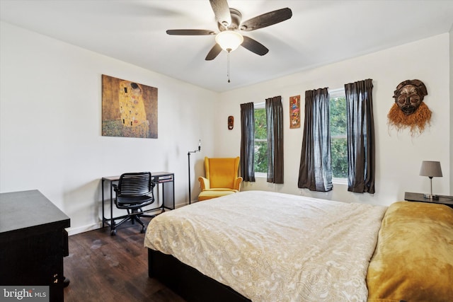 bedroom featuring ceiling fan and dark hardwood / wood-style floors