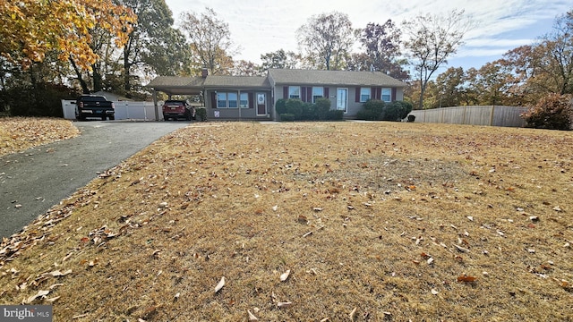 ranch-style home with a carport