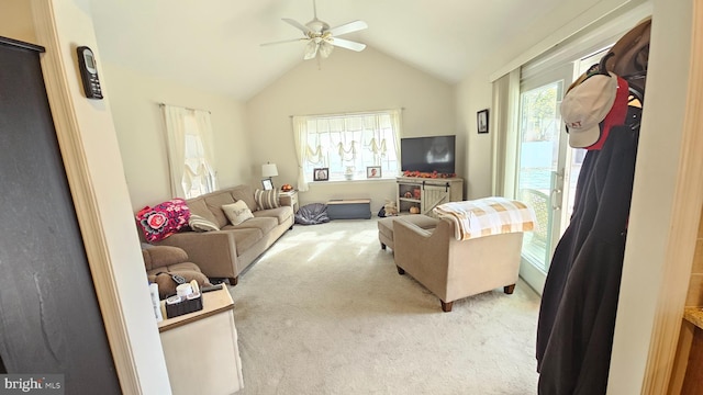 living room with light carpet, ceiling fan, and lofted ceiling