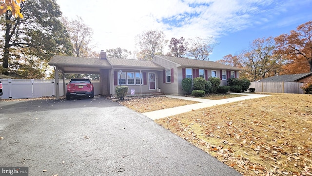 single story home with a carport