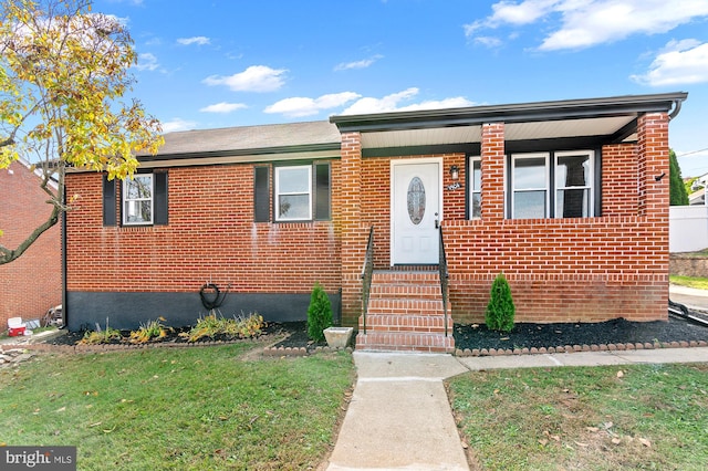 view of front of home with a front yard