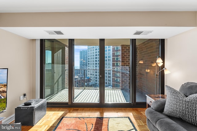 doorway to outside featuring light parquet flooring