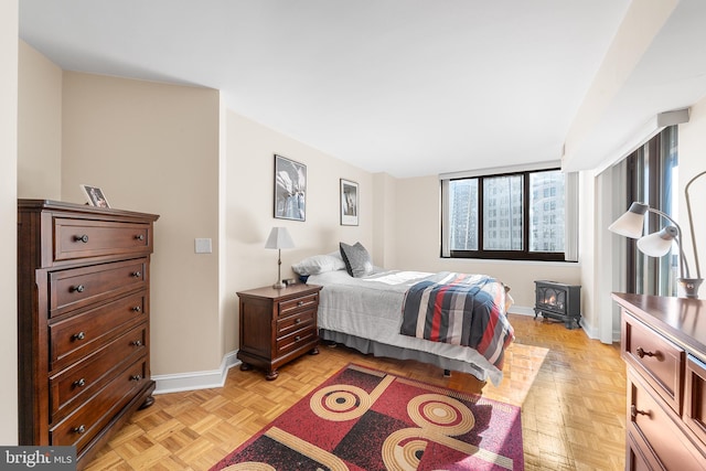 bedroom with light parquet floors