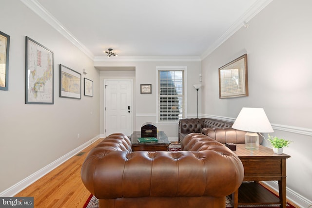 living room featuring wood-type flooring and crown molding