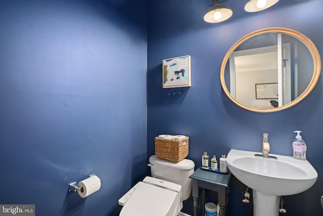 bathroom with toilet and sink