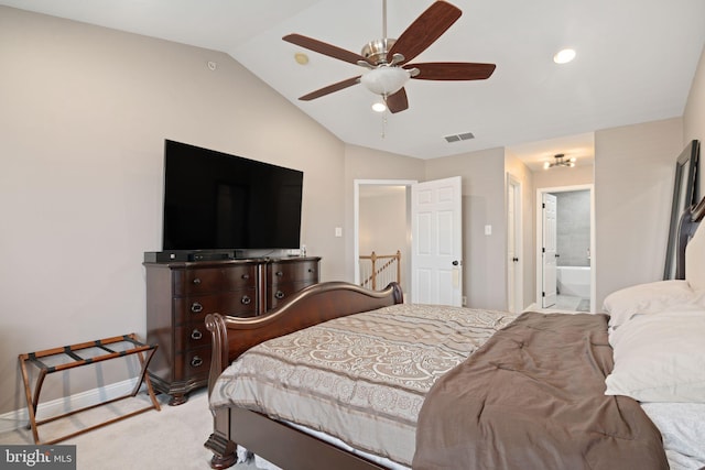 carpeted bedroom featuring ensuite bath, lofted ceiling, and ceiling fan