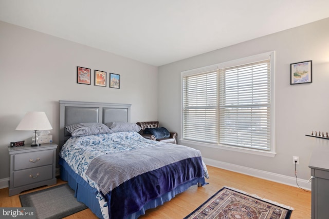 bedroom with light hardwood / wood-style flooring