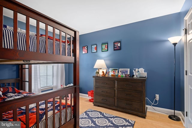 bedroom with light wood-type flooring