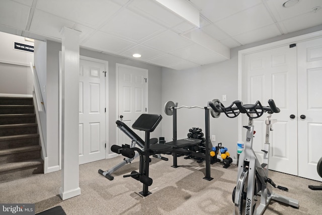 workout room featuring light colored carpet