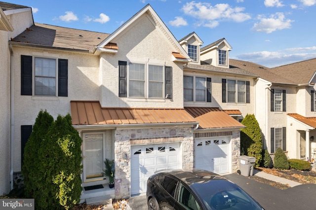 multi unit property featuring a garage