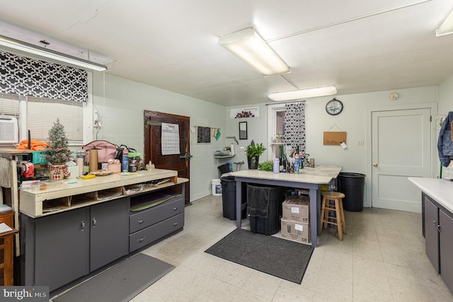 kitchen with light floors, light countertops, and gray cabinets