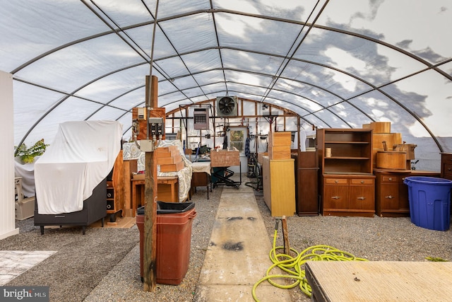 exterior space with vaulted ceiling