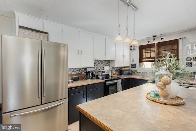 kitchen with white cabinetry, appliances with stainless steel finishes, backsplash, hanging light fixtures, and sink