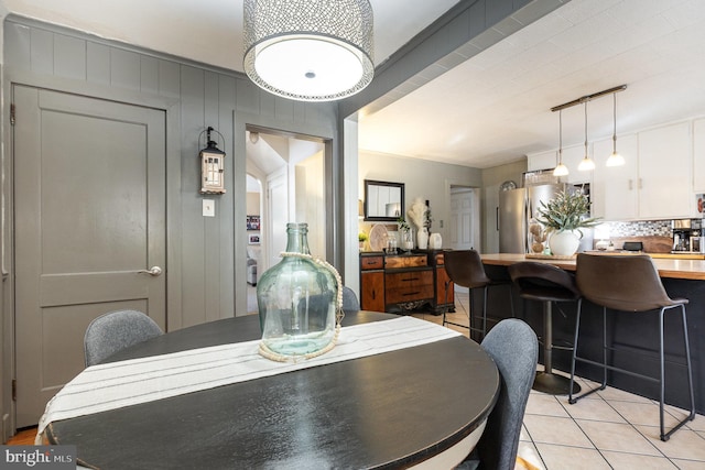 dining area featuring light tile patterned floors