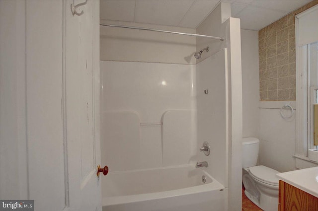 full bathroom featuring vanity, toilet, and  shower combination